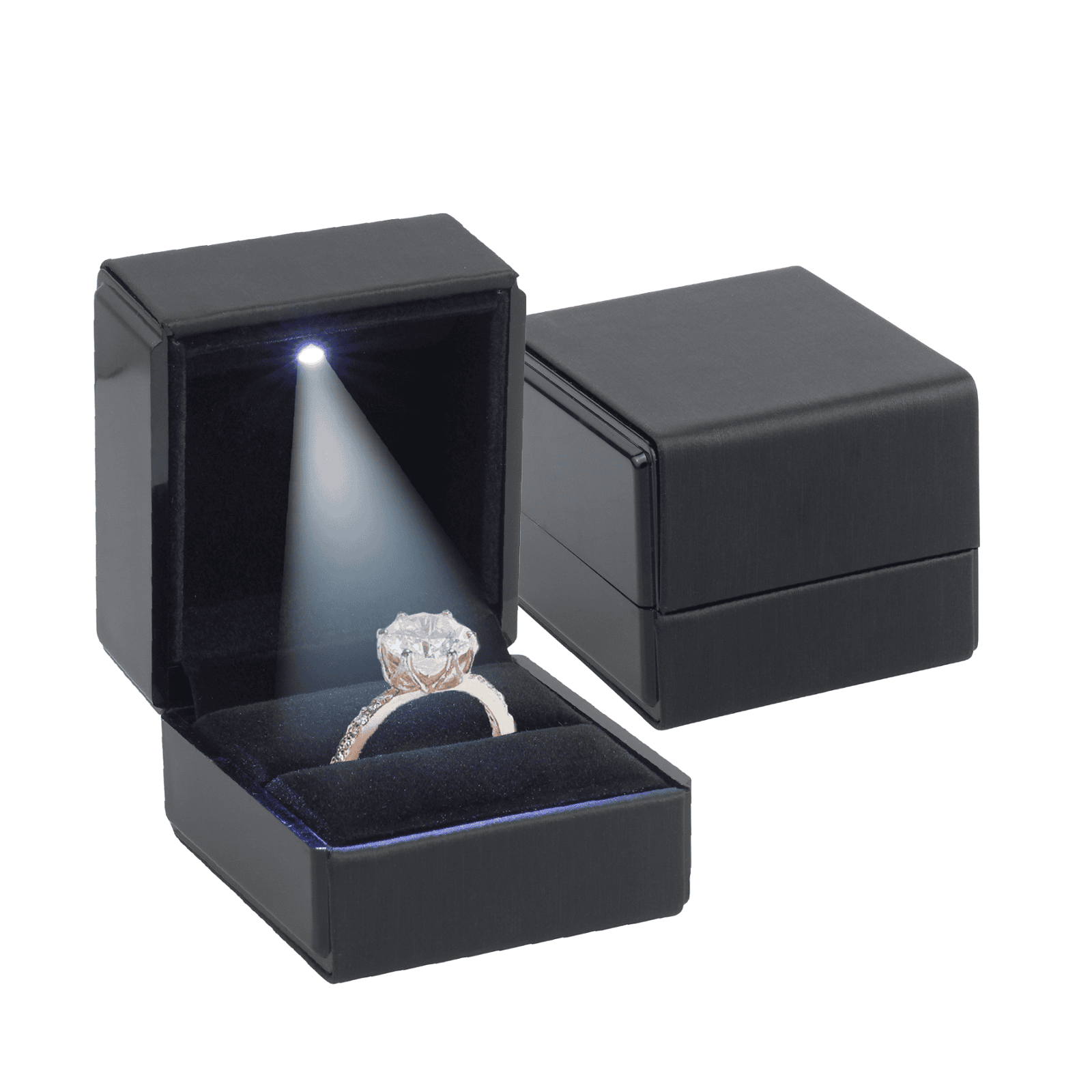 Luxurious black jewelry box with a built-in LED light illuminating a sparkling engagement ring featuring a large center stone and intricate band, perfect for elegant and memorable presentations.