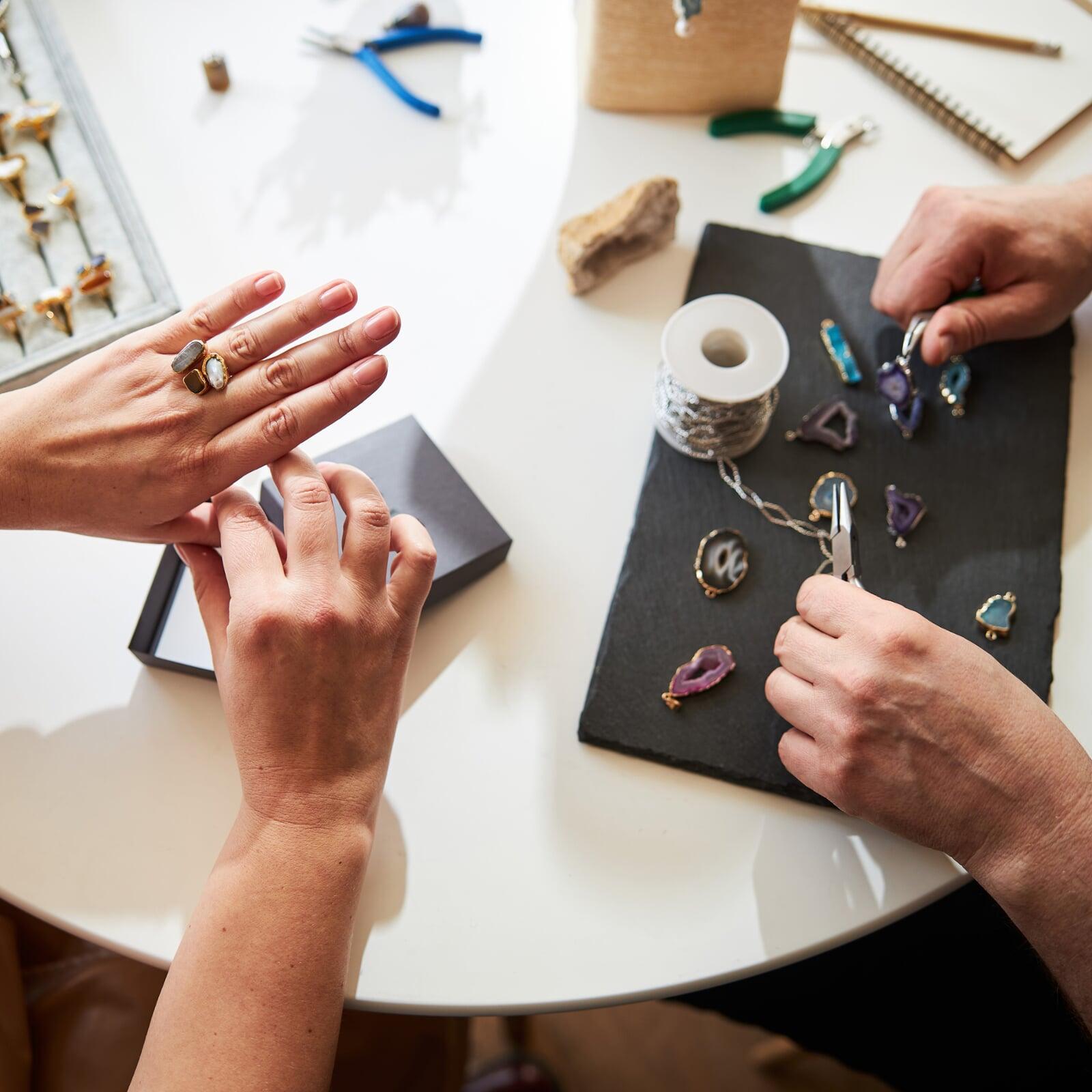 A luxurious jewelry store featuring a high-tech POS system, elegant displays of luxury jewelry, and a modern interior.